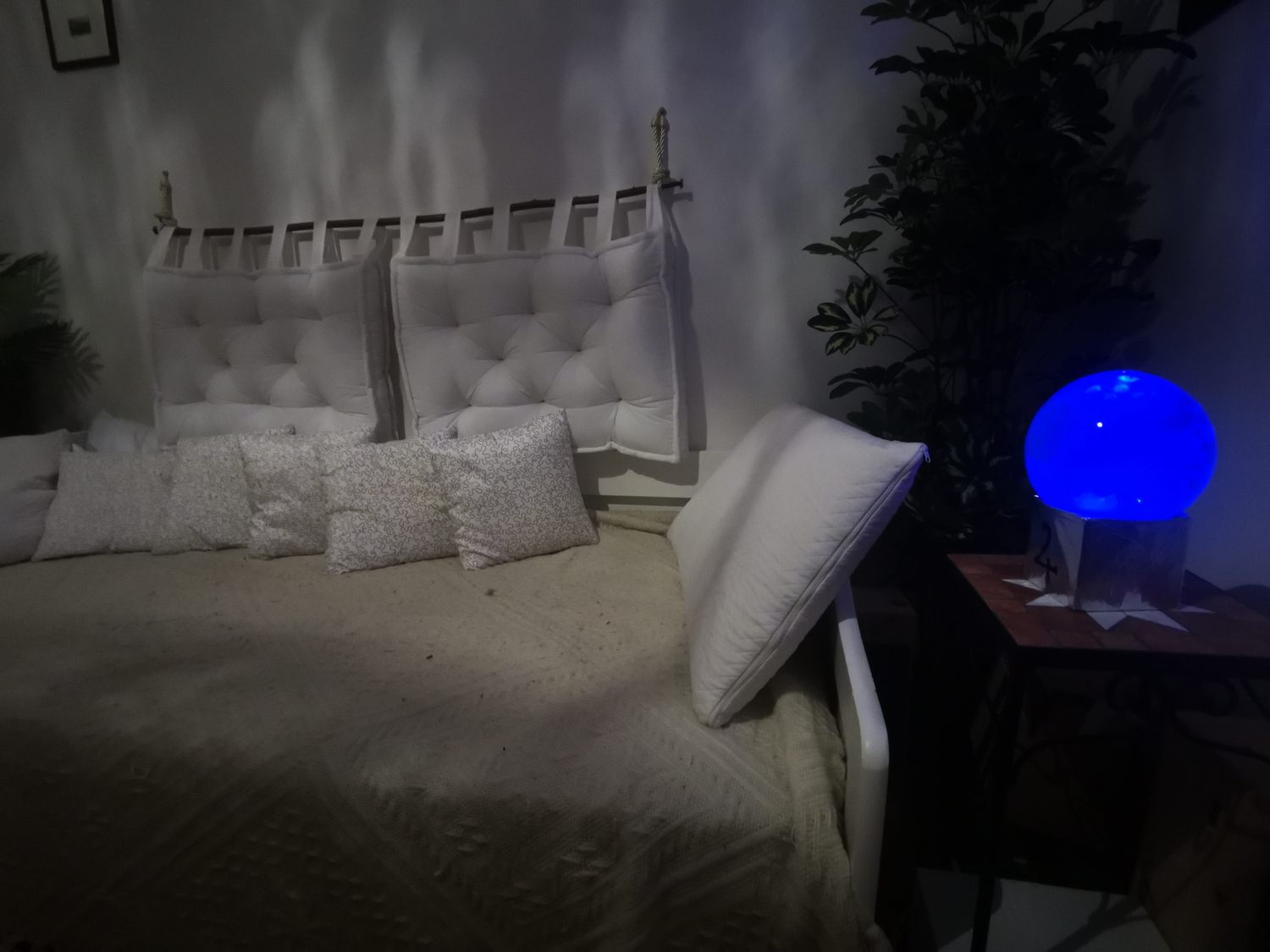 A planetary light beside the bed — real installation